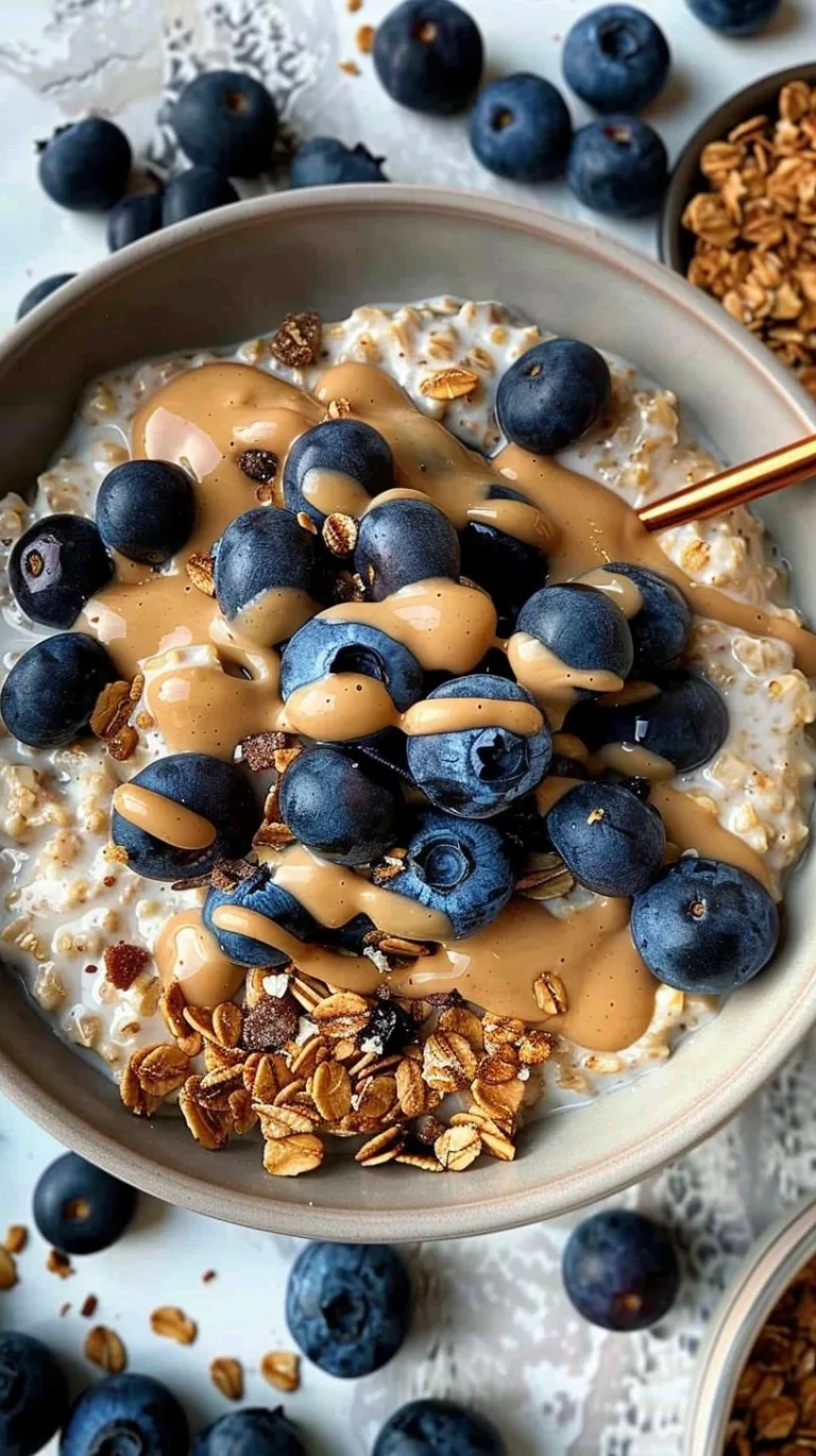 Bowl of classic overnight oats topped with fruits and nuts for a healthy breakfast.