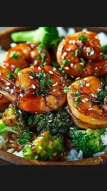Delicious honey garlic shrimp bowls garnished with fresh vegetables and rice.