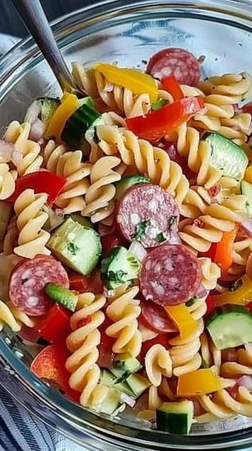 Delicious Italian pasta salad with fresh vegetables and dressing