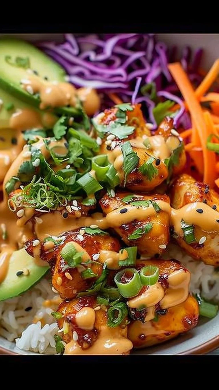 Delicious Bang Bang Chicken Bowl with crispy chicken and spicy sauce over rice