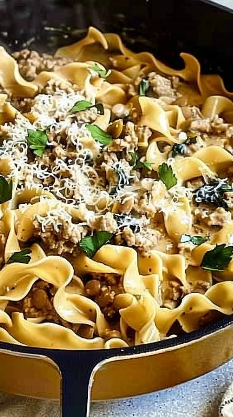 Creamy turkey stroganoff served on a plate with fresh herbs